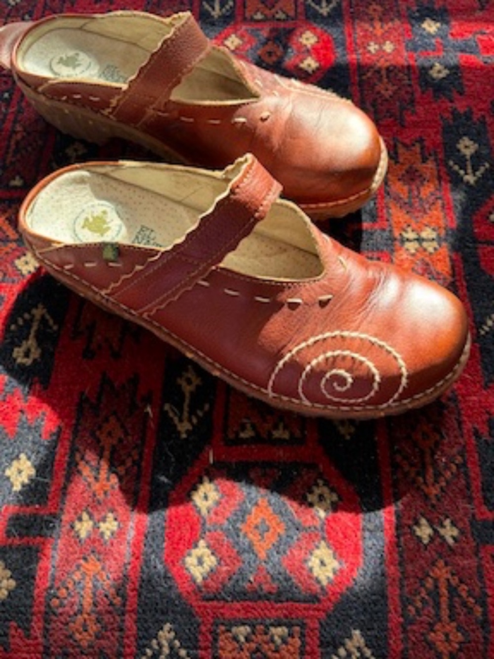 El Naturalista mule with swirl stitch, beautifully seasoned leather